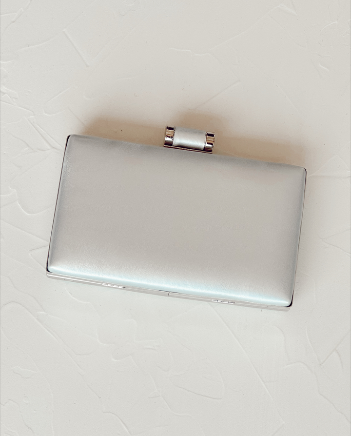 RECTANGULAR VICTORIA CLUTCH WITH SILVER CYLINDRICAL BROOCH